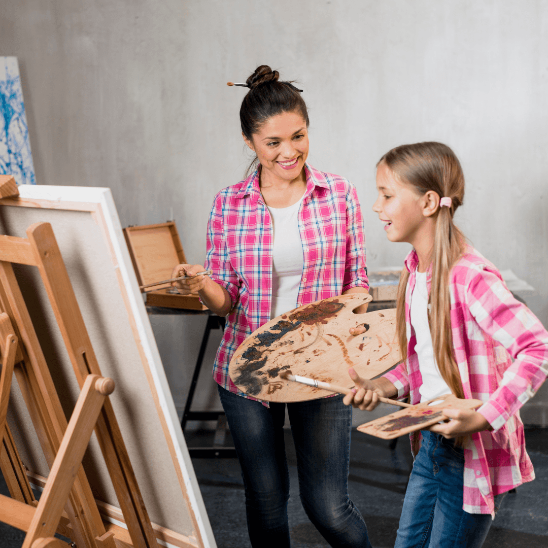 tutor teaching kid art and painting class in splatter room